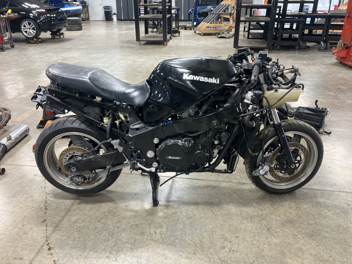 Kawasaki ZX-11 donor stripped of bodywork in the JTL Powersports shop