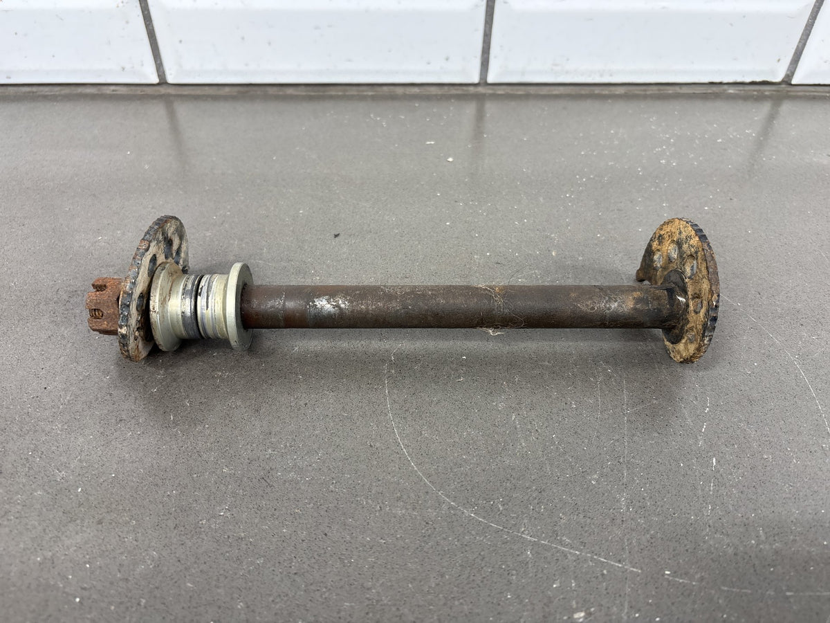 1991-1992 Kawasaki KX250, KX125 Rear Axle with Chain Adjuster Blocks OEM