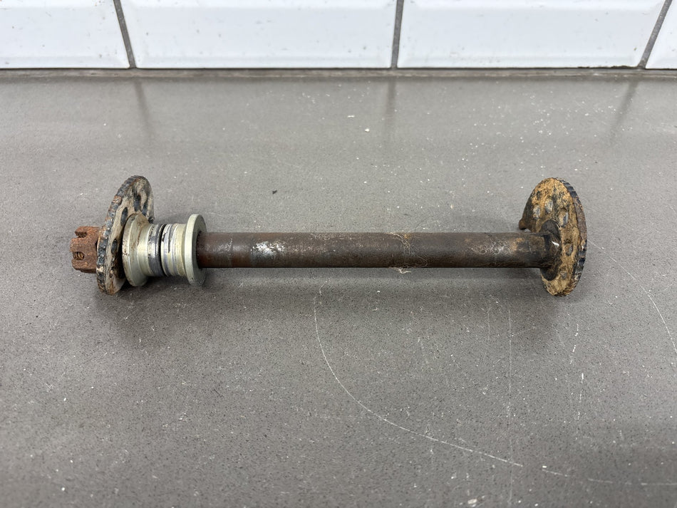 1991-1992 Kawasaki KX250, KX125 Rear Axle with Chain Adjuster Blocks OEM