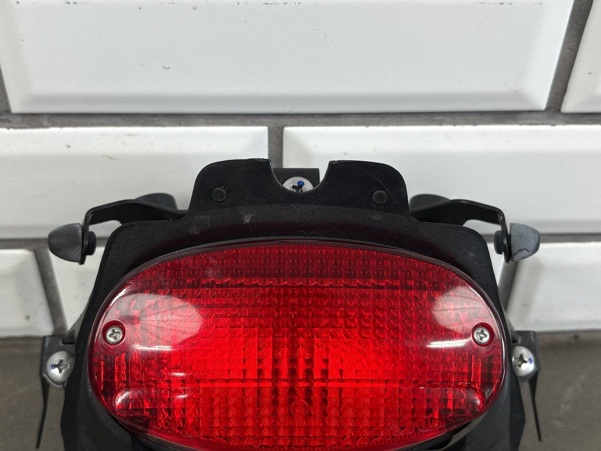 1999-2007 Yamaha YZF600R Tail Light Brake Light w/ Bracket Trim Red Lens OEM